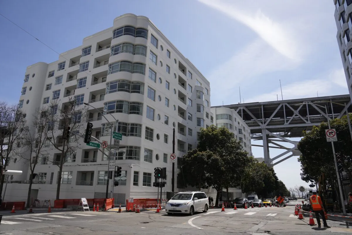 The scene outside an apartment building below the San Francisco-Oakland Bay Bridge where a technology executive was fatally stabbed in San Francisco on April 5, 2023. (Eric Risberg/AP Photo)