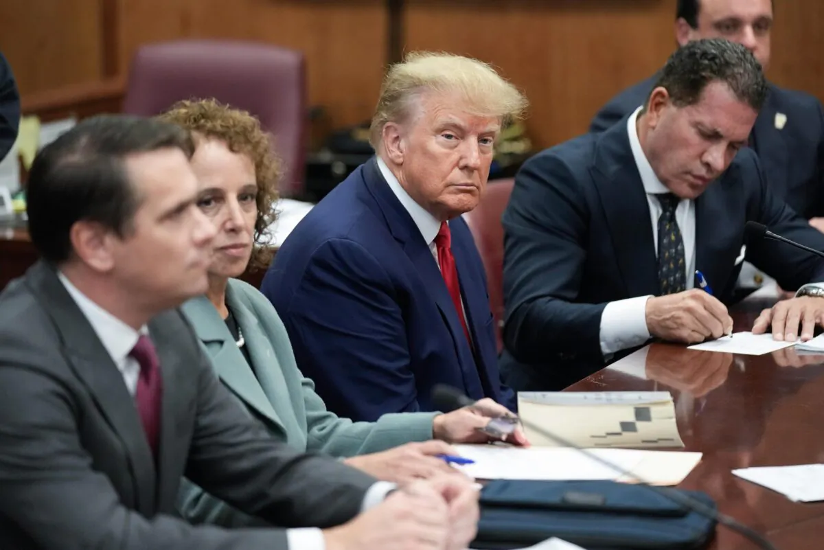 Former President Donald Trump sits at the defense table with his defense team in a Manhattan court in New York on April 4, 2023. (Seth Wenig/AP Photo)
