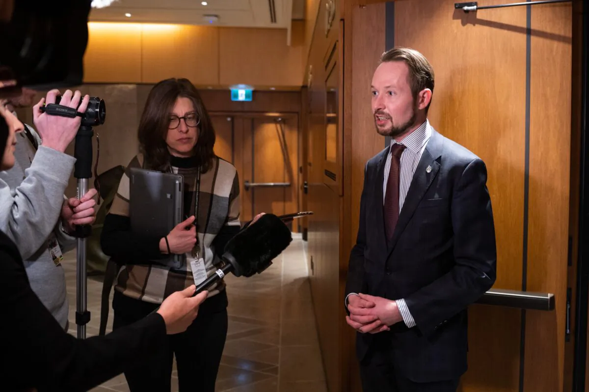 Conservative MP Michael Cooper speaks to members of the media during a break at the Standing Committee on Procedure and House Affairs regarding foreign election interference on Parliament Hill in Ottawa on March 1, 2023. (Spencer Colby/The Canadian Press)