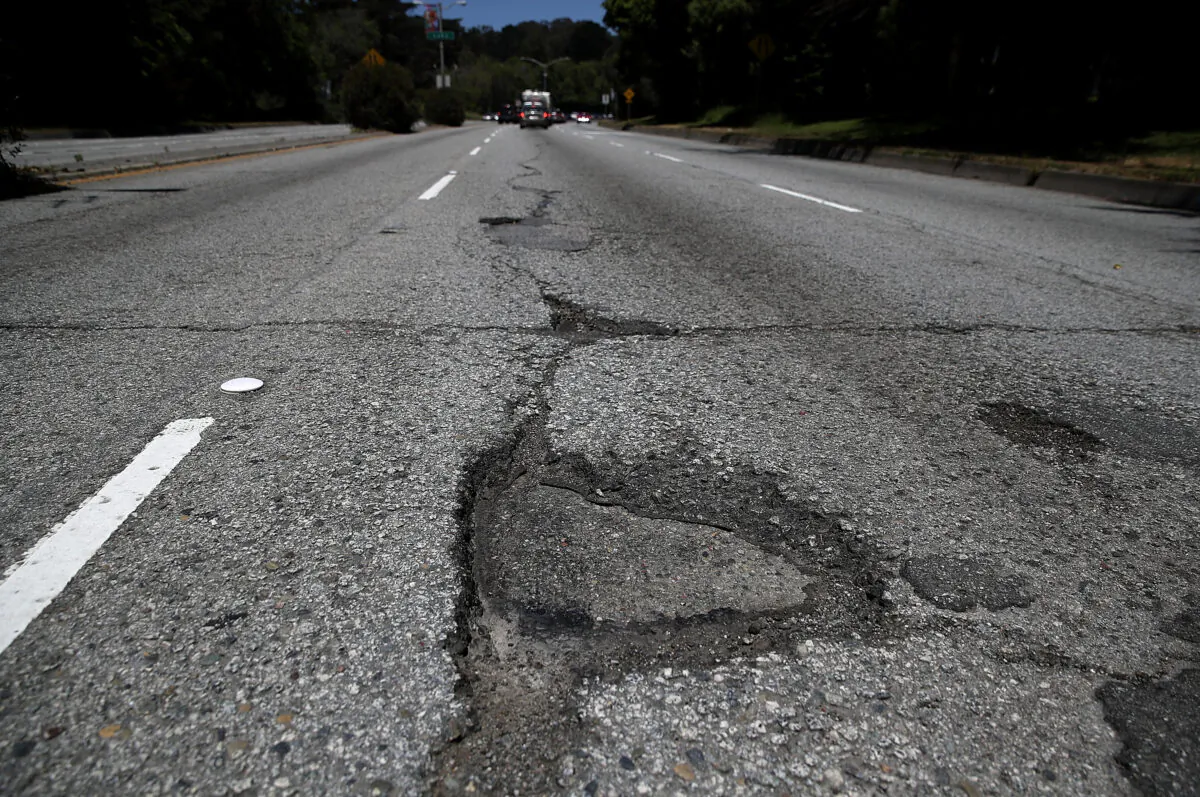 A pothole is visible on a street in this file image. (Justin Sullivan/Getty Images)