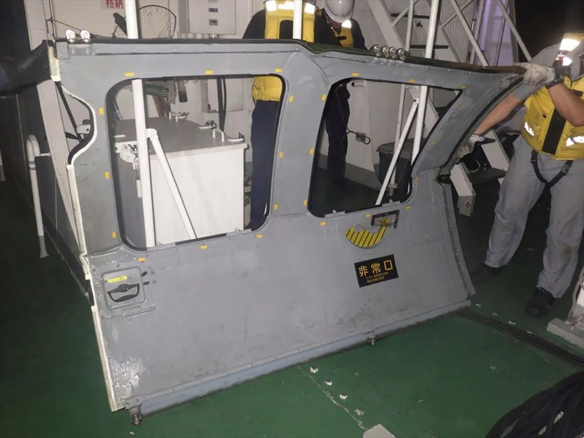 The door of an army helicopter that the coast guard found and retrieved from the sea, off Miyako Island, Okinawa Prefecture, southern Japan, on April 7, 2023. (11th Regional Japan Coast Guard Headquarters via AP)
