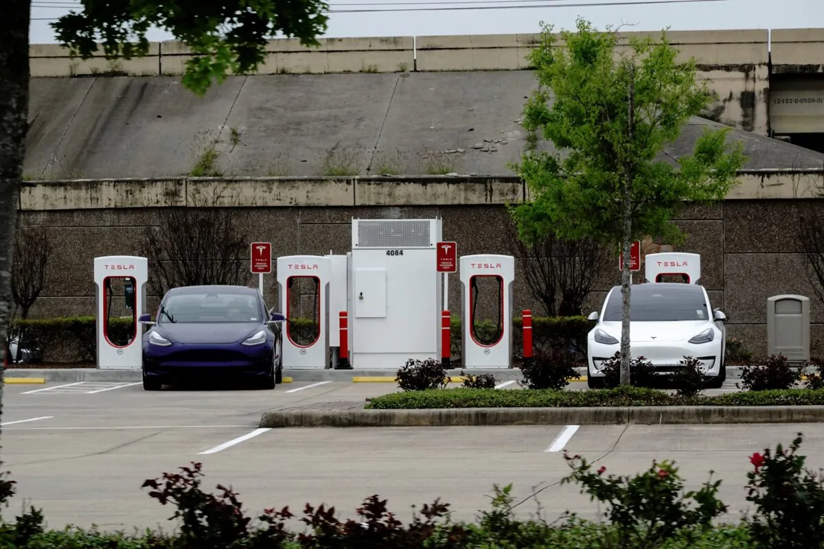 Tesla electric vehicles (EVs) fast-charge using Tesla Superchargers at a Buc-ee’s travel center and gas station in Baytown, Texas on March 18, 2023. (Bing Guan/Reuters)