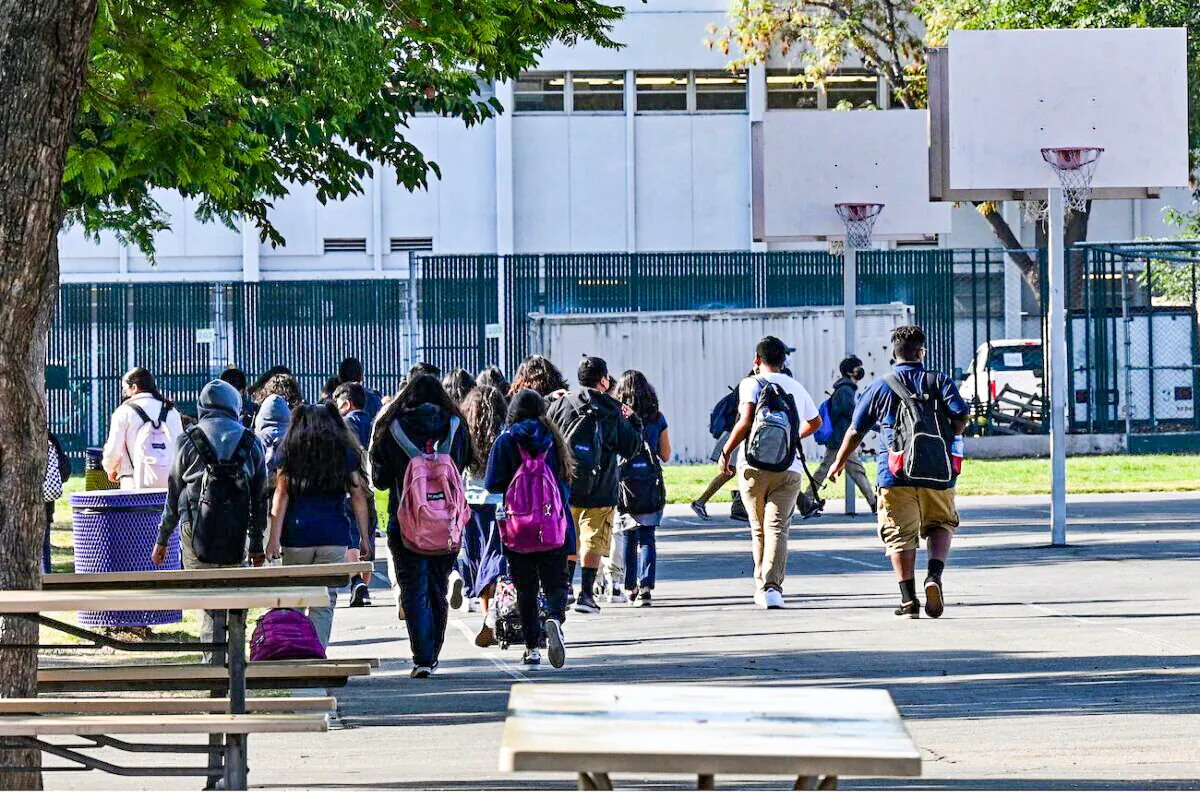 Students walk to their classrooms at a public middle school in Los Angeles, on Sept. 10, 2021. (Robyn Beck/AFP via Getty Images)