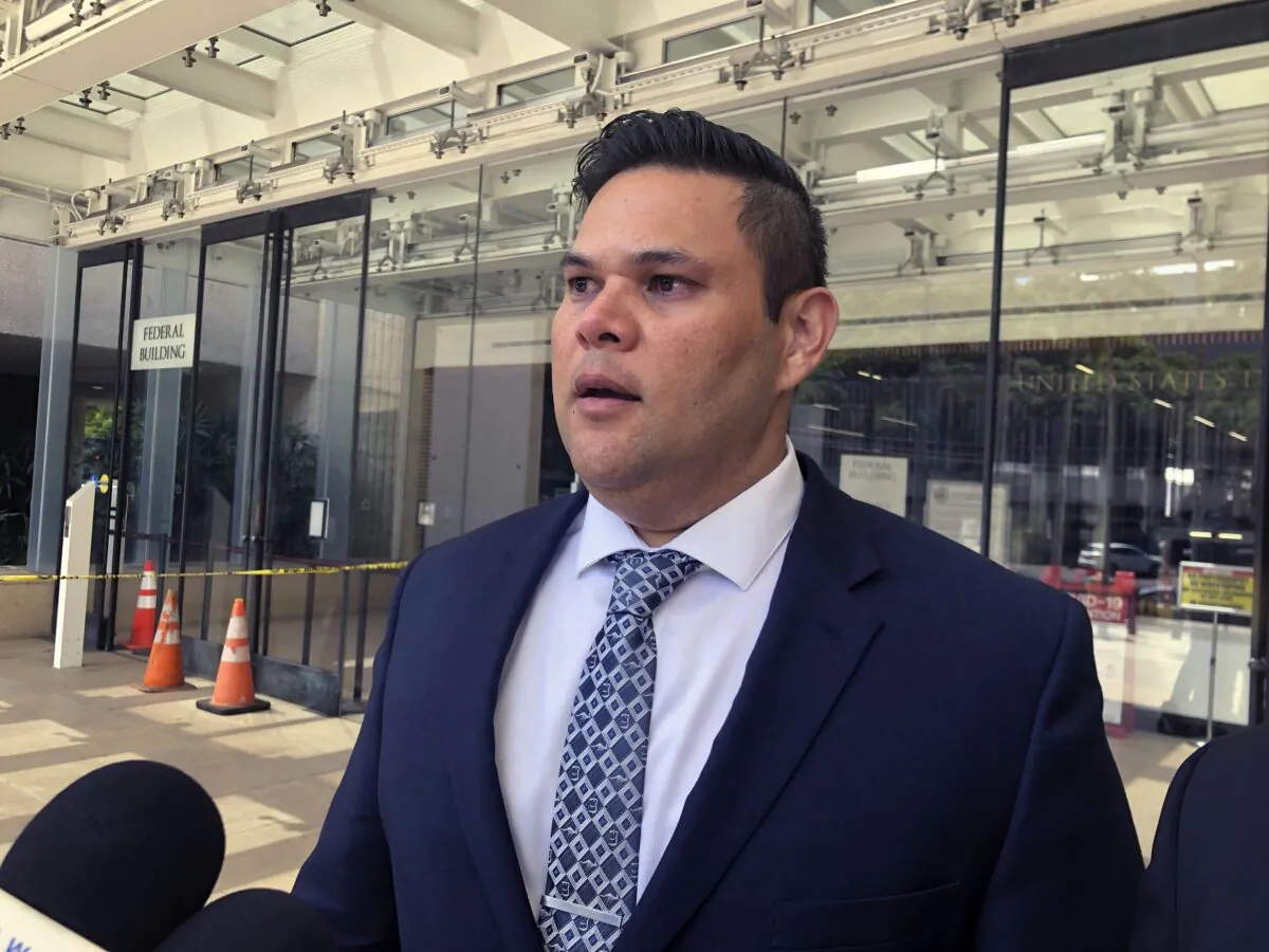 Former state Rep. Ty Cullen speaks to reporters outside U.S. District Court in Honolulu on April 6, 2023, after he was sentenced to two years in prison for taking bribes in exchange for influencing cesspool legislation. (Audrey McAvoy/AP Photo)