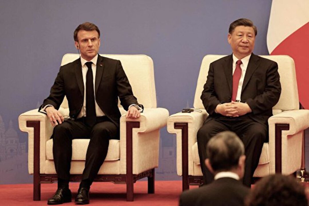 French President Emmanuel Macron and Chinese leader Xi Jinping take part in a Franco–Chinese business council meeting in Beijing on April 6, 2023. (Ludovic Marin/Pool/AFP via Getty Images)