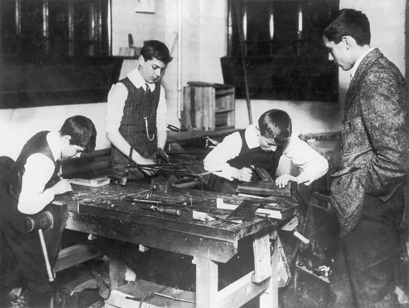 Mann wanted to schools to better prepare children for the workforce. Schoolboys in a woodwork class, circa 1915. (FPG/Hulton Archive/Getty Images)