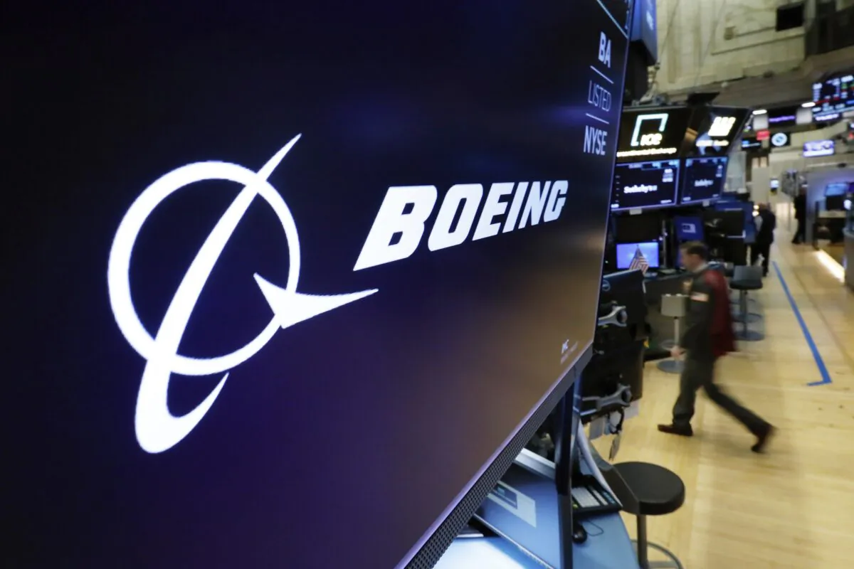 The Boeing logo appears above a trading post on the floor of the New York Stock Exchange on March 11, 2019. (Richard Drew/AP Photo)