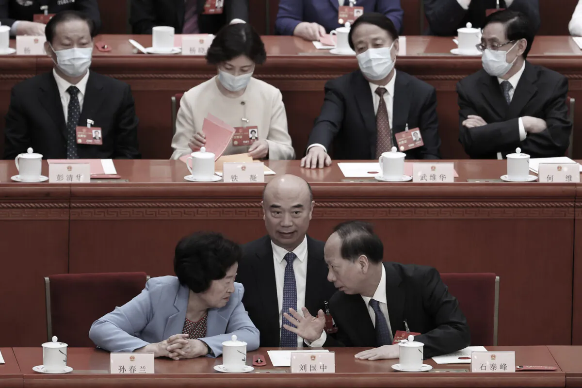 China's Vice Premier Sun Chunlan, CPC Central Committee Political Bureau member Liu Guozhong and Vice Chairman of Chinese People's Political Consultative Conference (CPPCC) Shi Taifeng attend the fourth plenary session of the National People's Congress in Beijing, on March 11, 2023.(Lintao Zhang/Getty Images)