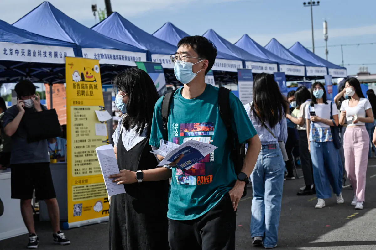 Young people attending a job fair in Beijing on Aug. 26, 2022. China's slowing economy has left millions of young people fiercely competing for an ever-slimming raft of jobs and facing an increasingly uncertain future. (Jade Gao/AFP via Getty Images)