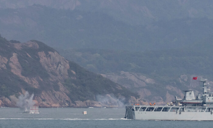 A Chinese warship fires at a target during a military drill near Fuzhou, Fujian Province, near the Taiwan-controlled Matsu Islands that are close to the Chinese coast, China, on April 8, 2023. (Thomas Peter/Reuters)