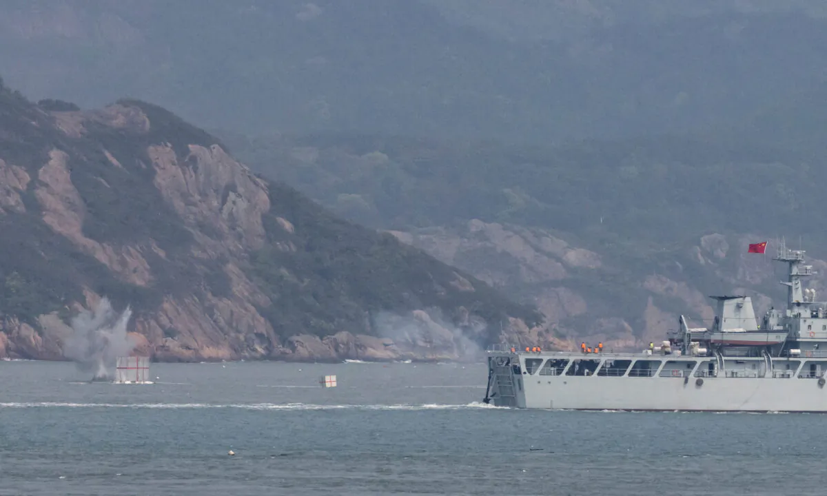 A Chinese warship fires at a target during a military drill near Fuzhou, Fujian Province, near the Taiwan-controlled Matsu Islands that are close to the Chinese coast, China, on April 8, 2023. (Thomas Peter/Reuters)