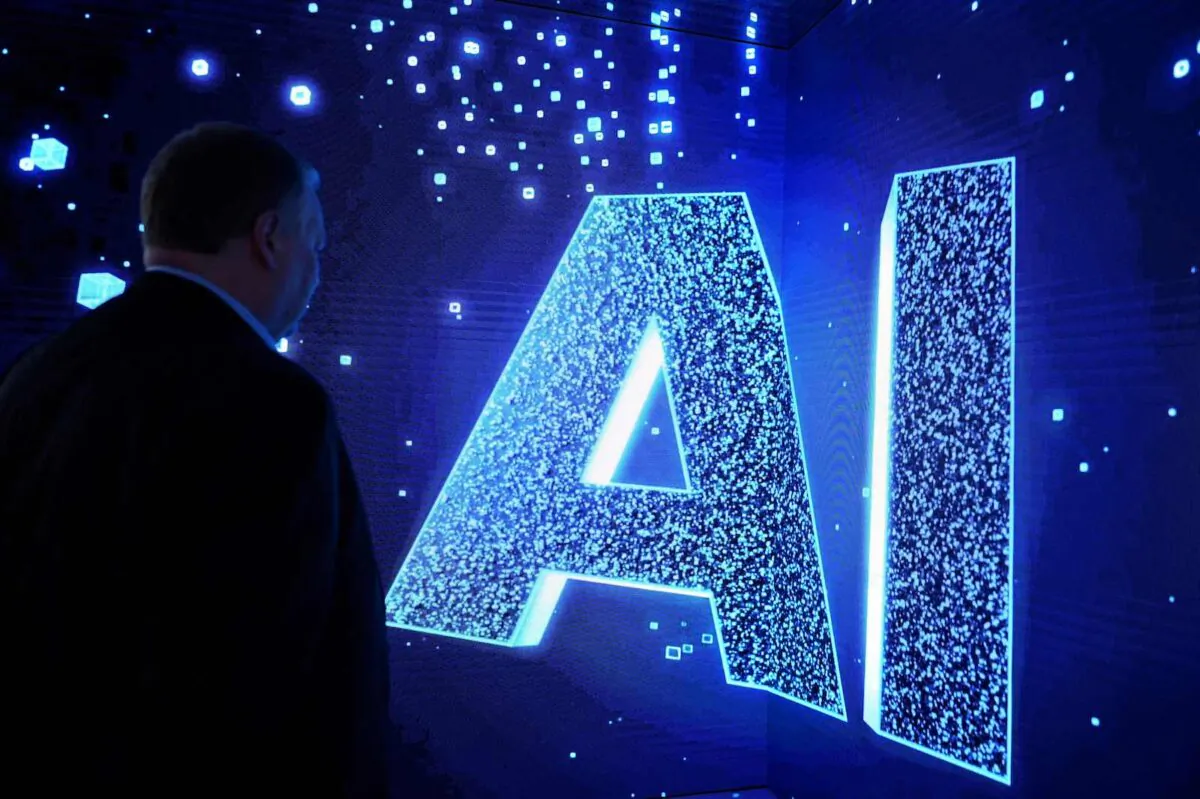 A visitor watches an AI (Artificial Intelligence) sign on an animated screen at the Mobile World Congress, the telecom industry's biggest annual gathering, in Barcelona, Spain. (Josep Lago/AFP via Getty Images)