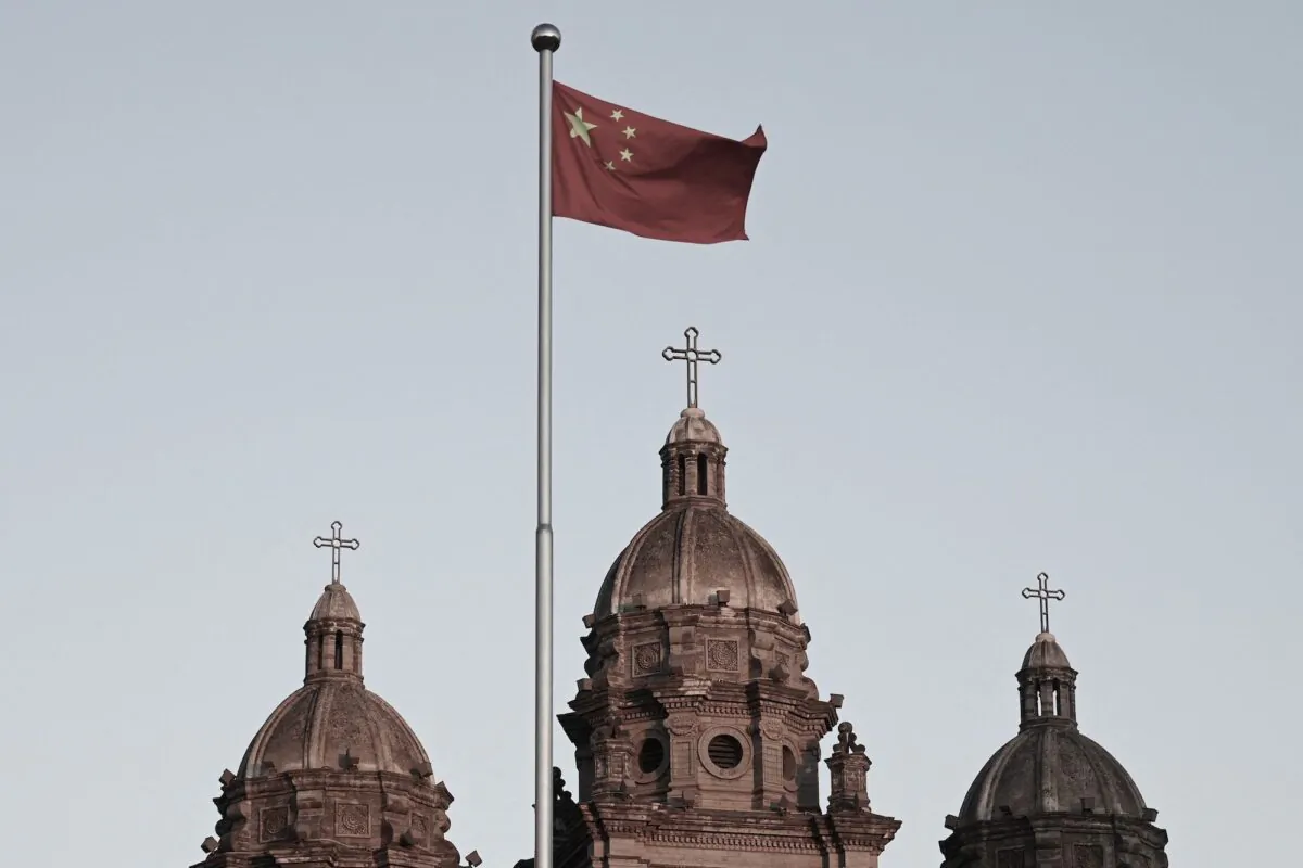 The Chinese communist flag flies in front of St. Joseph's Church, also known as Wangfujing Catholic Church, in Beijing on Oct. 22, 2020. (Greg Baker/AFP via Getty Images)