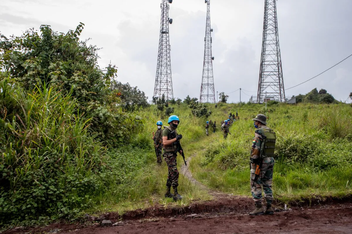 U.N. peacekeepers secure the way as ambulances transport victims from the location where Italian Ambassador Luca Attanasio was fatally attacked when the convoy he was traveling in came under attack near the village of Kibumba, Democratic Republic of Congo, on Feb. 22, 2021. (Guerchom Ndebo/Getty Images)