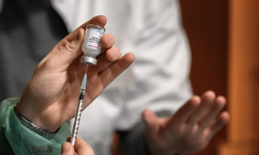 A COVID-19 vaccine is prepared in Switzerland on Dec. 14, 2021. (Fabrice Coffrini/AFP via Getty Images)