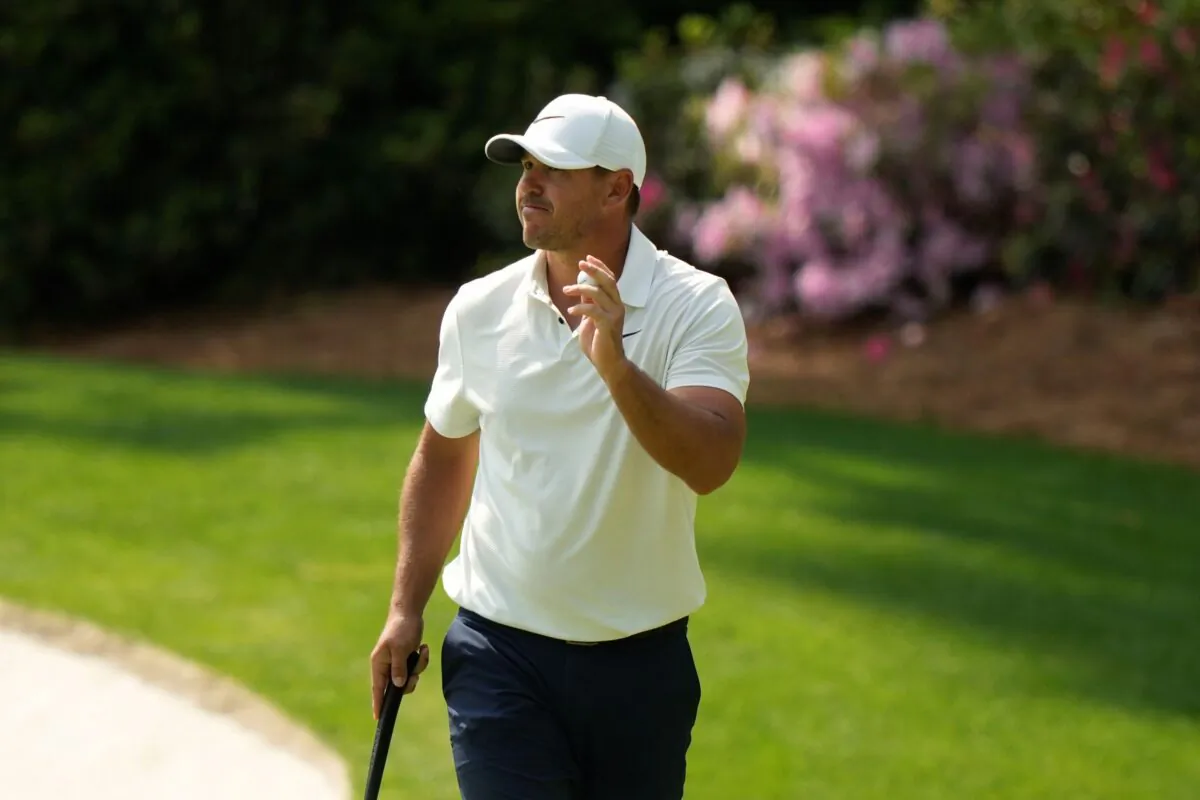 Brooks Koepka waves after his putt on the 13th hole during the second round of the Masters golf tournament at Augusta National Golf Club in Augusta, Ga., on April 7, 2023. (Charlie Riedel/AP Photo)
