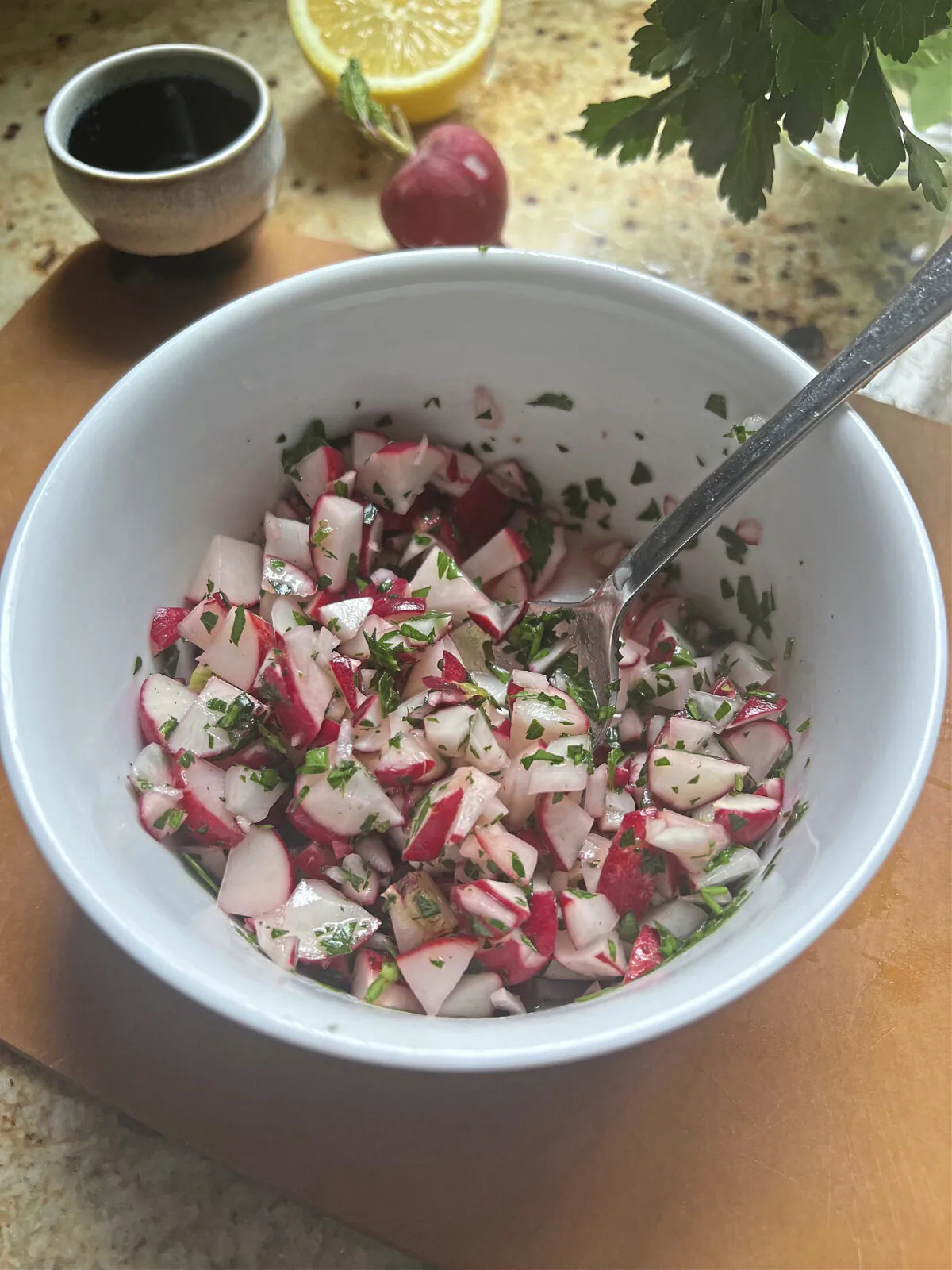 This refreshing spring salad made with radishes, lemon and parsley will add a pop of color to the dinner table. (Gretchen McKay/Pittsburgh Post-Gazette/TNS)