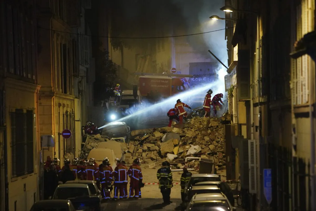 Firefighters work after building collapsed in Marseille, southern France, early on April 9, 2023. (AP Photo)