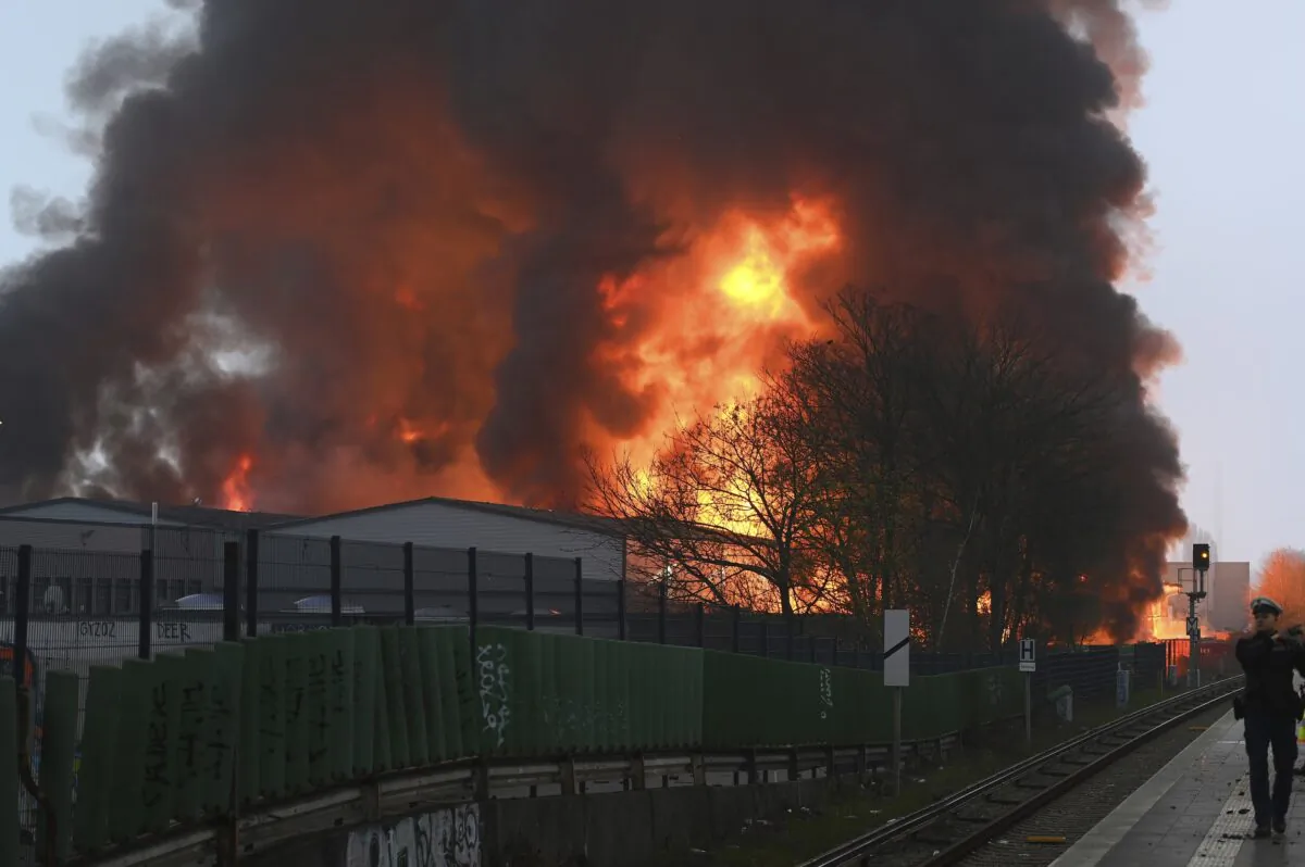 Huge flames rise from a fire in Hamburg, Germany, on April 9, 2023. (Jonas Walzberg/dpa via AP)