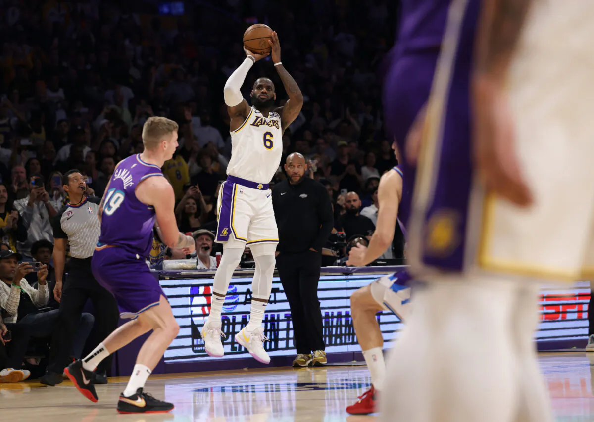 LeBron James (6) of the Los Angeles Lakers scores on a three pointer in front of Luka Saminic (19) of the Utah Jazz, resulting in a 128–117 Lakers win in Los Angeles on April 09, 2023. (Harry How/Getty Images)