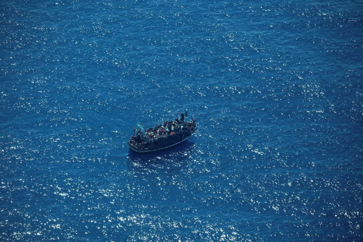 The boat in distress with about 400 people on board in Central Mediterranean Sea in a handout obtained on April 10, 2023. (Giacomo Zorzi/Sea-Watch/Handout via Reuters)