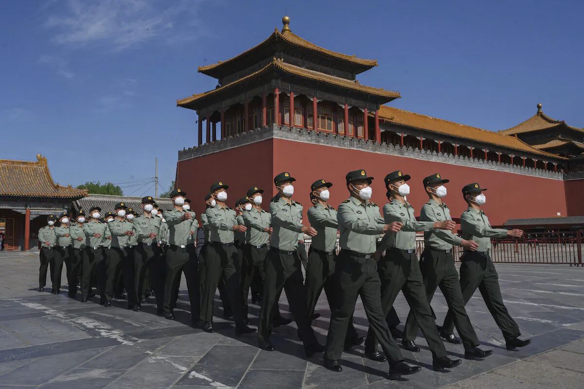 Soldiers of the People's Liberation Army's Honor Guard Battalion march outside the Forbidden City in Beijing on May 20, 2020. (Kevin Frayer/Getty Images)