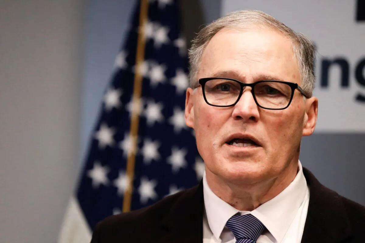SEATTLE, WA - MARCH 16: Washington state Governor Jay Inslee, joined by King County Executive Dow Constantine and Seattle Mayor Jenny Durkan hold a press conference to provide details on a temporary statewide shutdown of restaurants, bars, and entertainment and recreational facilities to mitigate the effects of the COVID-19 outbreak, on March 16, 2020 in Seattle, Washington. Inslee declared a state of emergency in response to new cases of COVID-19 earlier this month. (Photo by Elaine Thompson - Pool/Getty Images)
