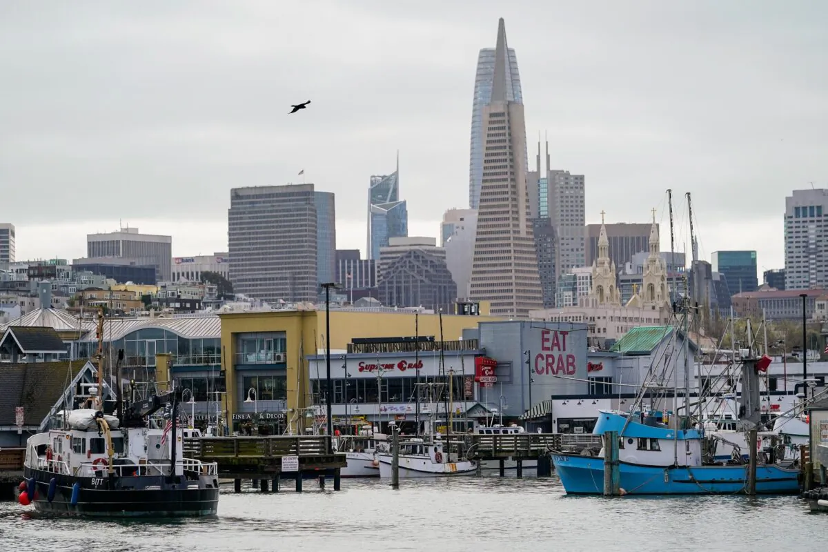 FILE - Fishing boats can be seen at Pier 45 in San Francisco, March 20, 2023. A federal regulatory group has voted to officially close king salmon fishing season along much of the West Coast after near-record low numbers of the fish, also known as Chinook, returned to California's rivers in 2022. (AP Photo/Godofredo A. Vásquez, File)