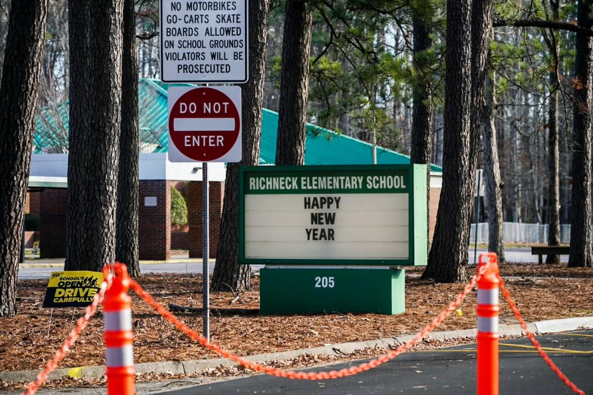 NEWPORT NEWS, VA - JANUARY 07: A school sign wishing students a "Happy New Year" is seen outside Richneck Elementary School on January 7, 2023 in Newport News, Virginia. A 6-year-old student was taken into custody after reportedly shooting a teacher during an altercation in a classroom at Richneck Elementary School on Friday. The teacher, a woman in her 30s, suffered “life-threatening” injuries and remains in critical condition, according to police reports. (Photo by Jay Paul/Getty Images)