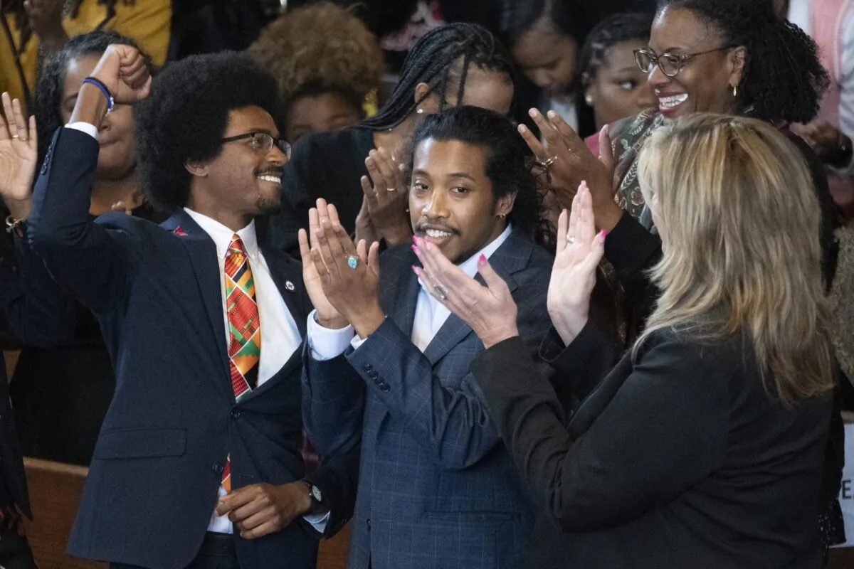 (L–R) Expelled Rep. Justin Pearson (D-Memphis), expelled Rep. Justin Jones (D-Nashville), and Rep. Gloria Johnson (D-Knoxville) are recognized by the audience at Fisk University before Vice President Kamala Harris arrives in Nashville, Tenn., on April 7, 2023. (George Walker IV/AP Photo)