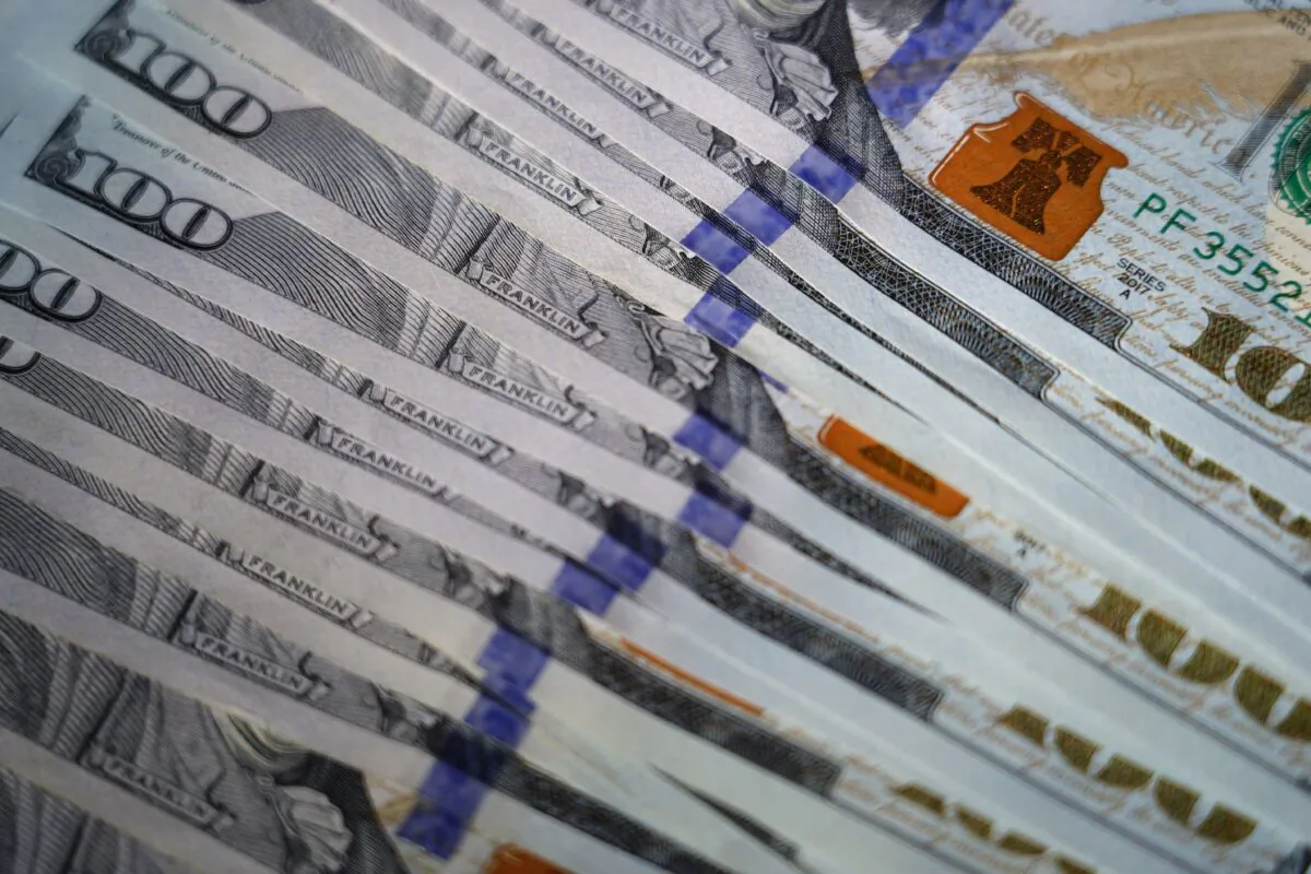 U.S. $100 bills are seen in Marple Township, Pa., on July 14, 2022. (Matt Slocum/AP Photo)