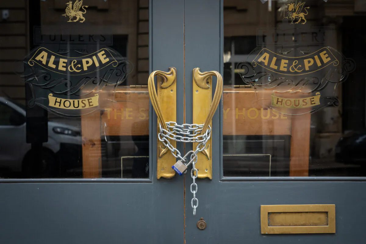 Chains securing the doors of a closed Fuller's pub in London on Jan. 28, 2021. (PA)