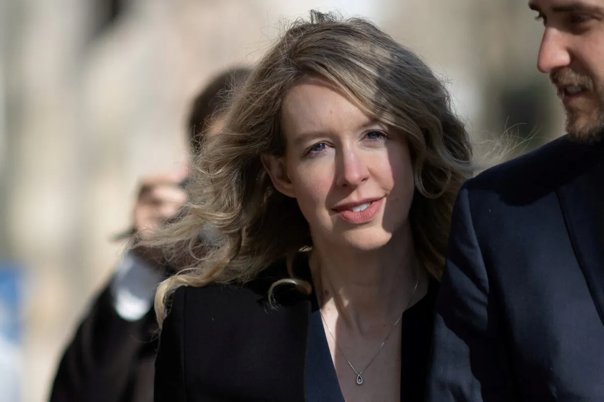 Theranos founder Elizabeth Holmes arrives at the federal courthouse accompanied by her partner Billy Evans, in San Jose, Calif., on March 17, 2023. (Carlos Barria/Reuters)