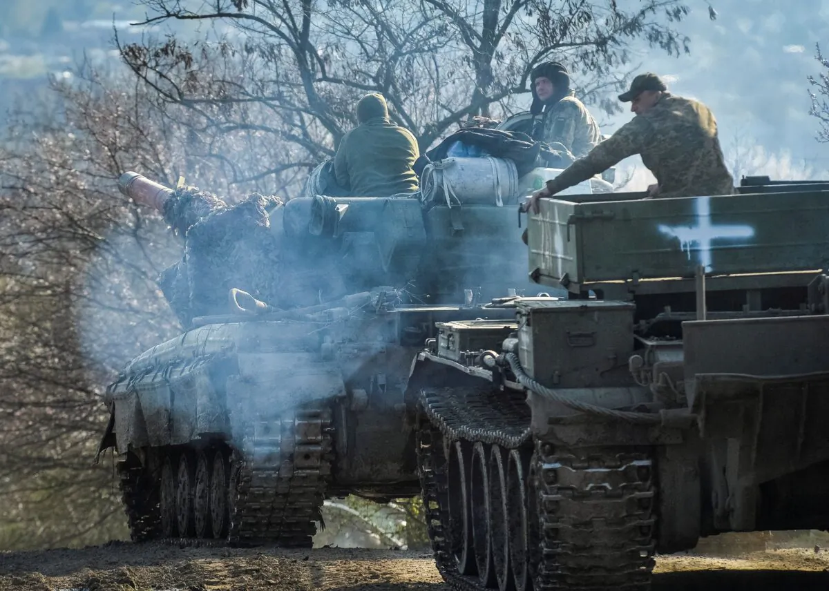 Ukrainian service members ride tanks near the front-line city of Chasiv Yar, Ukraine, on April 10, 2023. (Oleksandr Klymenko/Reuters)