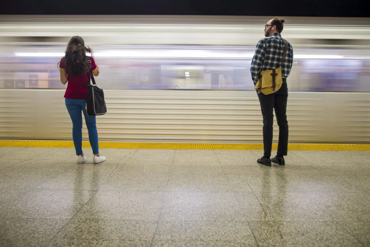 Commuters wait to take the subway at Ossington Station in Toronto on June 22, 2018. (The Canadian Press/Tijana Martin)