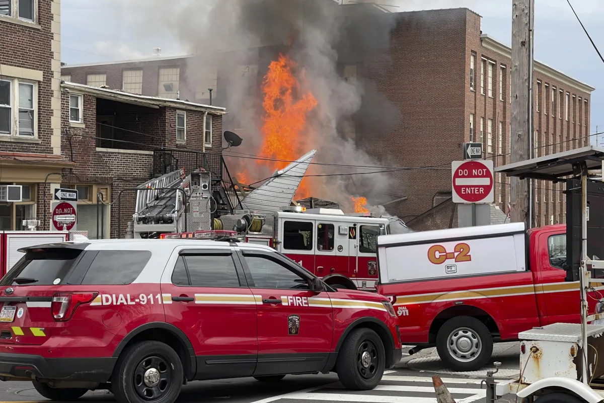 Emergency personnel work at the site of a deadly explosion at a chocolate factory in West Reading, Pa., on March 25, 2023. (Ben Hasty/Reading Eagle via AP)
