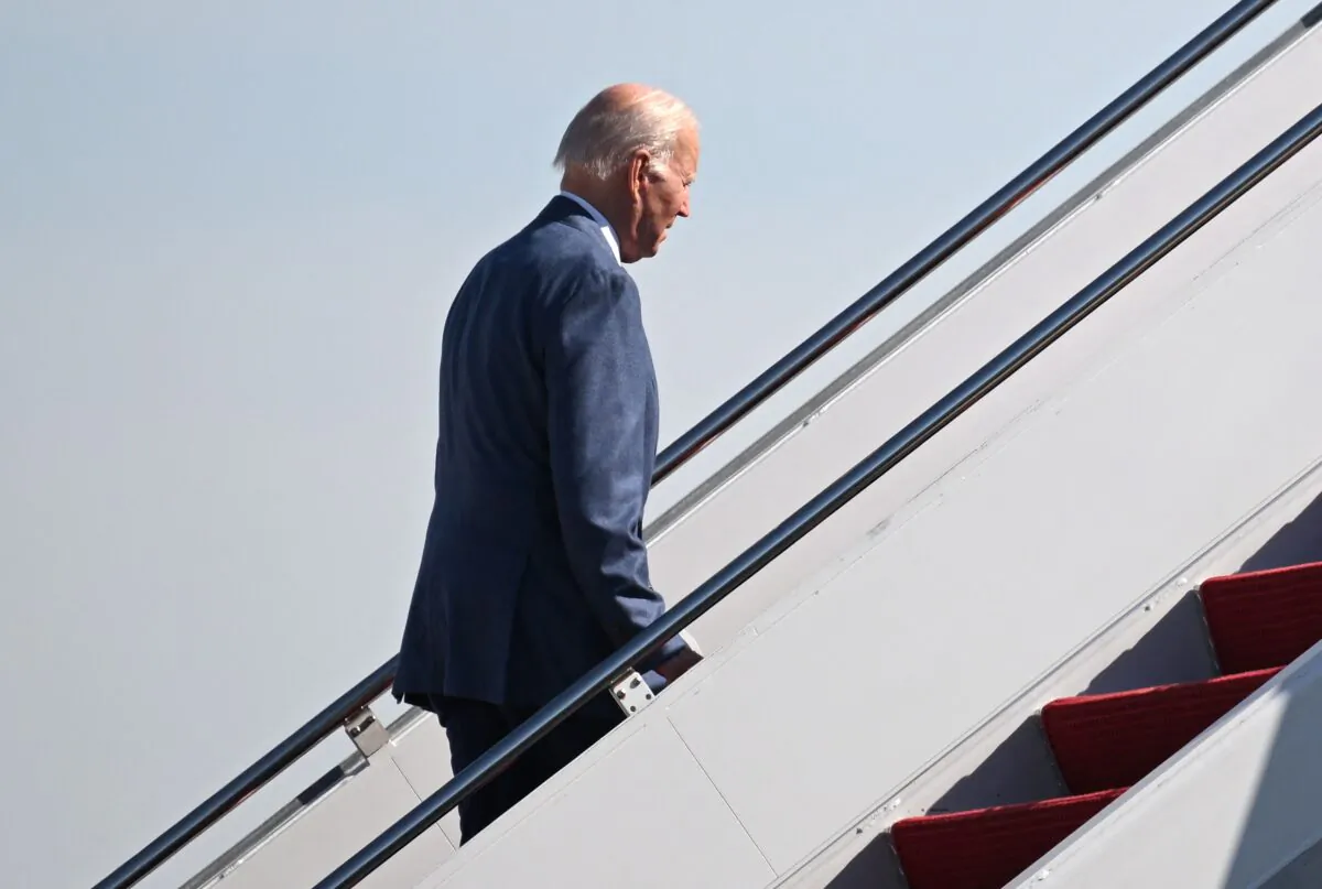 U.S. President Joe Biden boards Air Force One, as he departs for Northern Ireland, at Joint Base Andrews in Maryland on April 11, 2023. (Mandel Ngan/AFP via Getty Images)