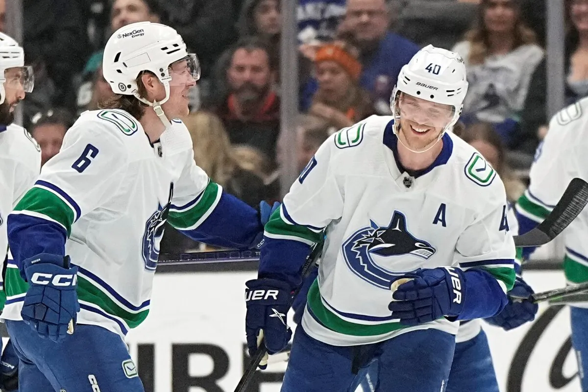 Vancouver Canucks center Elias Pettersson (R), celebrates his goal with right wing Brock Boeser during the first period of an NHL hockey game against the Anaheim Ducks in Anaheim, Calif., on April 11, 2023. (Mark J. Terrill/AP Photo)