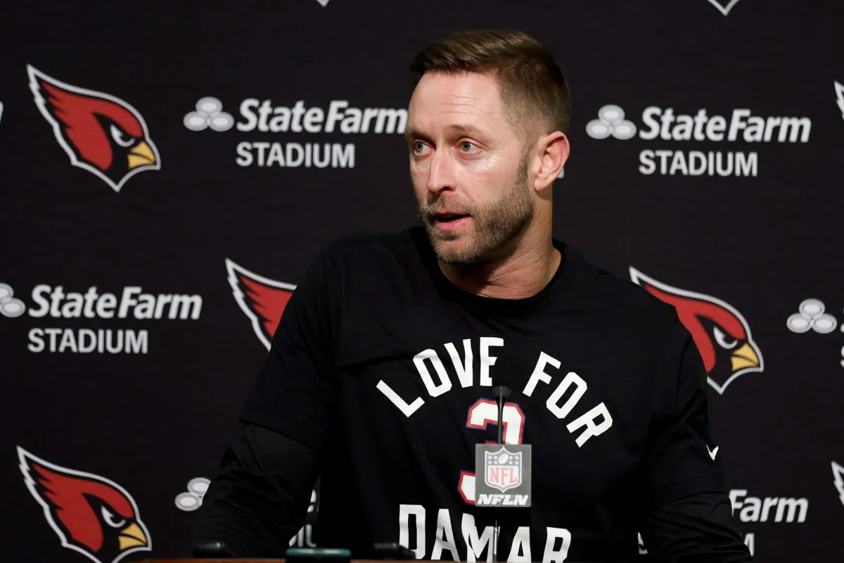 Arizona Cardinals head coach Kliff Kingsbury wears a shirt in support of Buffalo Bills' Damar Hamlin as he speaks at a news conference after the team's NFL football game against the San Francisco 49ers in Santa Clara, Calif., on Jan. 8, 2023. (Jed Jacobsohn/AP Photo)
