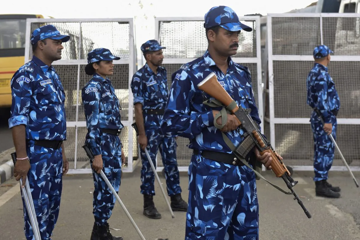 Paramilitary forces stand guard along a road on the outskirts of Amritsar, Punjab, India, on May 21, 2022. (Narinder Nanu/AFP via Getty Images)