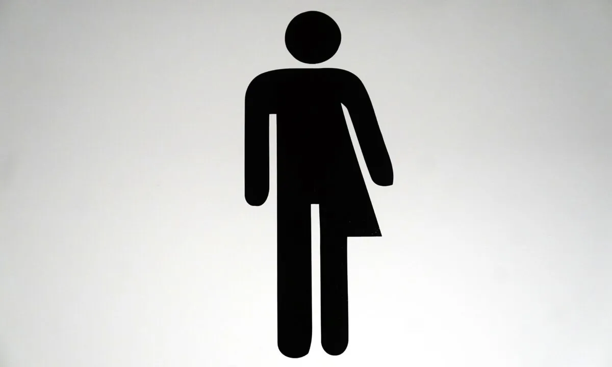 A sign for unisex toilet on Jan. 21, 2022. (Victoria Jones/PA Media)

