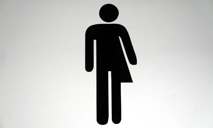 A sign for unisex toilet on Jan. 21, 2022. (Victoria Jones/PA Media)

