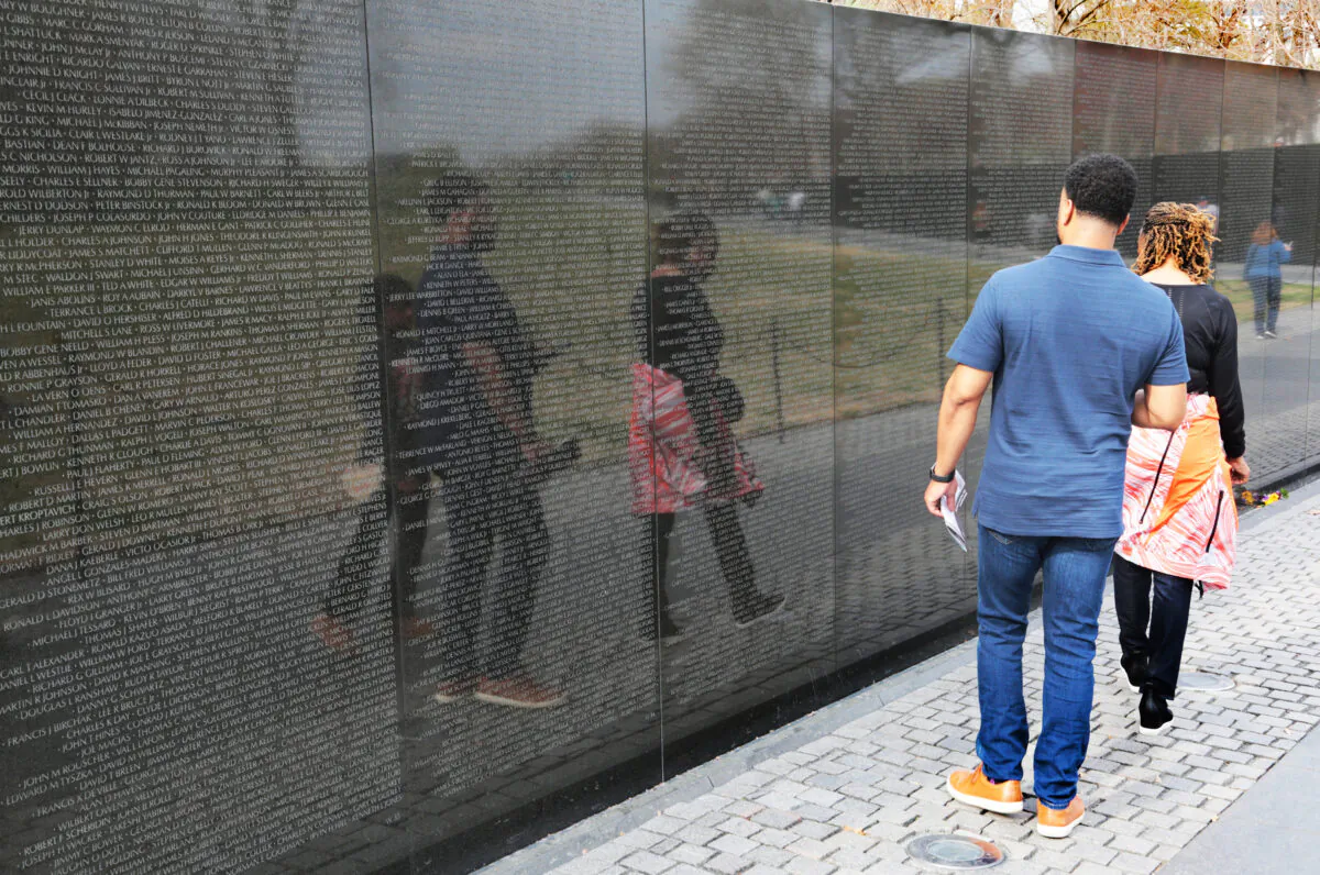 The names of more than 58,000 U.S. service men and women who died during the Vietnam War are carved into two 200-foot-long walls of the Vietnam Veterans Memorial in Washington on March 23, 2023. (Richard Moore/The Epoch Times)