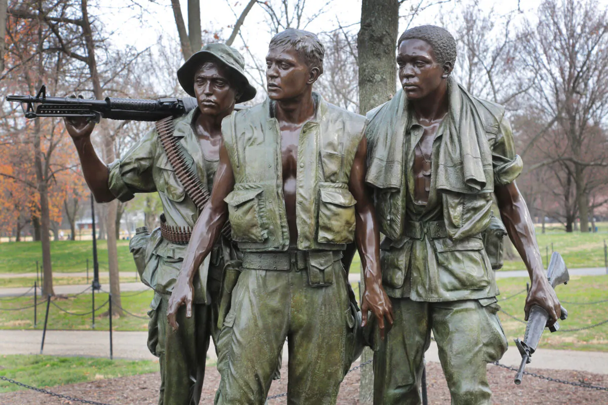 A statue honors servicemen near the Vietnam Veterans Memorial in Washington on March 23, 2023. (Richard Moore/The Epoch Times)