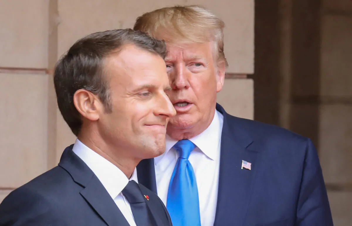 French President Emmanuel Macron speaks with then President Donald Trump ahead of a meeting at the Prefecture of Caen, on the sidelines of D-Day commemorations marking the 75th anniversary of the World War II Allied landings in Normandy, France, on June 6, 2019. (Ludovic Marin/Pool via Reuters) 