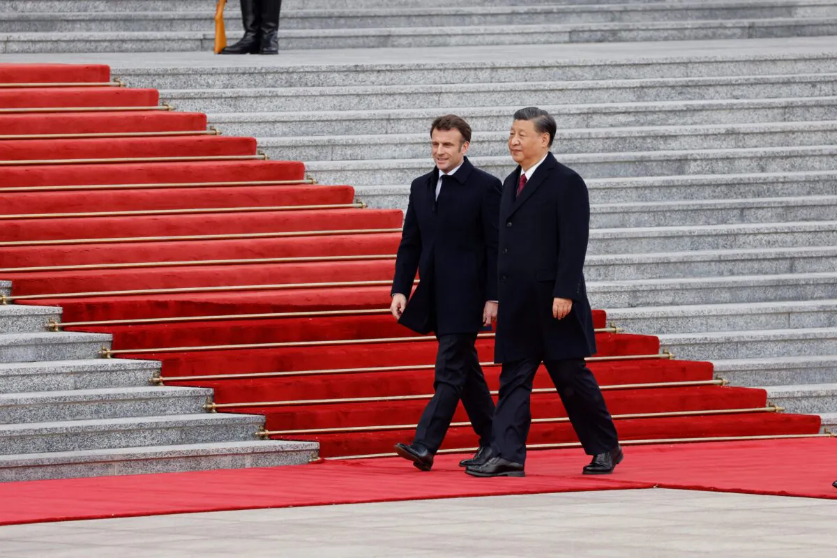 Chinese leader Xi Jinping (R) and French President Emmanuel Macron attend the official welcoming ceremony in Beijing on April 6, 2023. (Ludovic Marin/AFP via Getty Images)