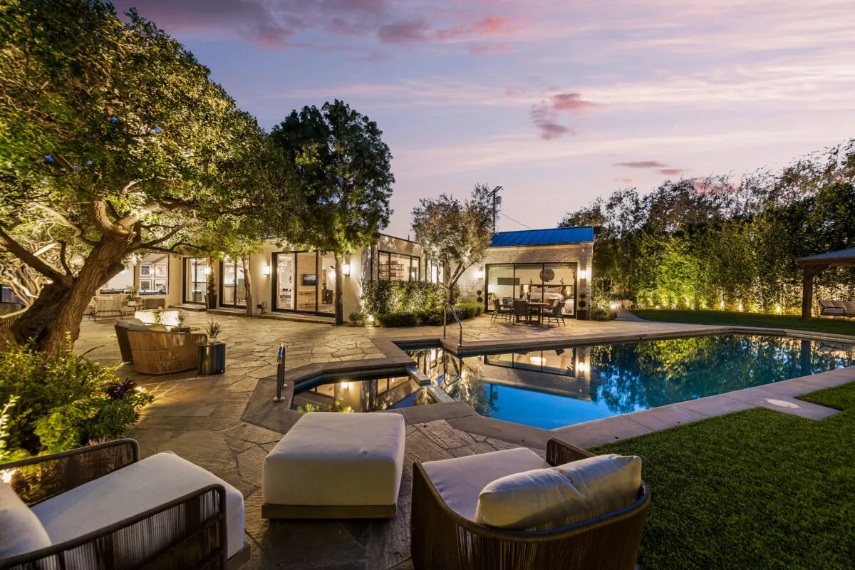 The home’s large, saltwater pool is perfect to swim laps for exercise, followed by relaxing in the hot tub. (Courtesy of One Shot Productions, TopTenRealEstateDeals.com)