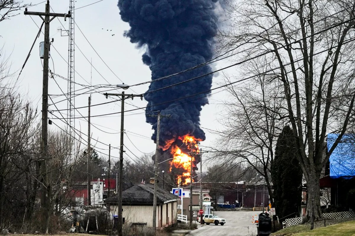 A black plume rises over East Palestine, Ohio, as a result of a controlled detonation of a portion of the derailed Norfolk Southern Monday, Feb. 6, 2023. (AP Photo/Gene J. Puskar)