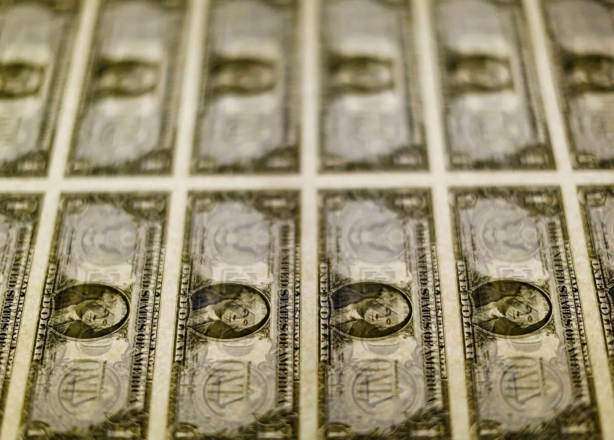 U.S. $1 bills are seen on a light table at the Bureau of Engraving and Printing in Washington, on Nov. 14, 2014. (Gary Cameron/Reuters)