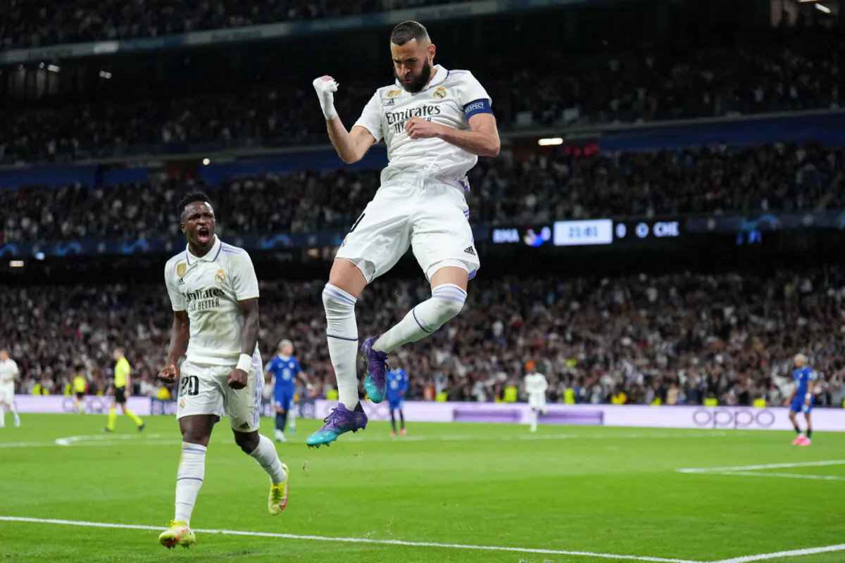 Karim Benzema of Real Madrid celebrates after scoring the team's first goal with teammate Vinicius Junior during the UEFA Champions League quarterfinal first leg match between Real Madrid and Chelsea FC at Estadio Santiago Bernabeu in Madrid on April 12, 2023. (Angel Martinez/Getty Images)